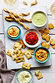 Assorted dips and crackers with wine
