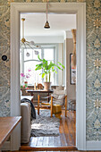 View through doorway to living room with houseplants