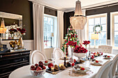 Christmas dining table in the dining room with Christmas tree