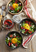 Green savoy cabbage shakshuka with feta cheese and egg