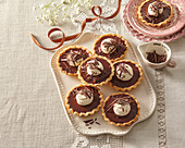 Chocolate tartlets with whipped cream