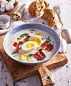 White Easter soup with bacon, egg and dill