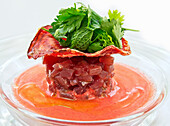 Tuna timbale with grilled Parma ham