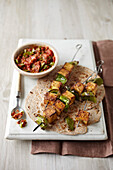 Spiced paneer skewers with green chili sauce