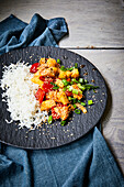 Sweet and sour chicken with sesame seeds