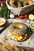 Poppy seed bagel with scrambled eggs