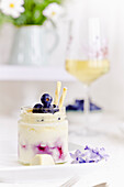 Cheesecake in a glass with fresh blueberries