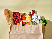 Full paper grocery bag with healthy products, Organic food concept
