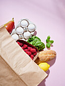 Full paper grocery bag with healthy products. Organic food concept