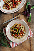 Strozzapreti with sweet pepper topping