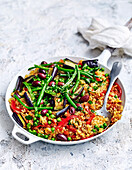 Vegetable and olive paella