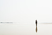 Young Woman Walking On The Beach From Huohu, North Of Kinmen Island; Taiwan