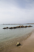 Rocks In The Water Off The Beach; Peyia, Paphos, Cyprus