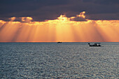 Dramatic Sky With Sun Rays Filtering Down Out Of The Storm Clouds Over The Horizon; Paphos, Cyprus