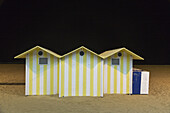 Yellow And White Striped Structures On The Beach; Benidorm, Spain