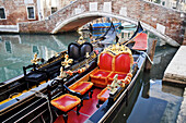 Gondolas In A Canal; Venice, Italy