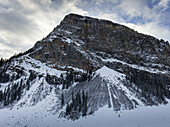 Rugged Mountain With Snow In Winter; Lake Louise, Alberta, Canada