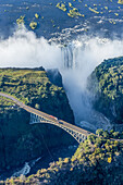 Aerial View Of Victoria Falls Behind Bridge; Botswana