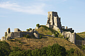 Ancient Ruined Castle Perched On A Verdant Hill