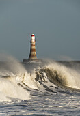 Waves Breaking And Roker Pier Lighthouse; Sunderland, Tyne And Wear, England