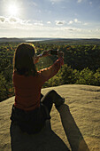 Woman Taking Photos With A Smart Phone In Algonquin Park; Ontario, Canada