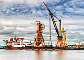 Offshore vessel in dock with crane; North Shields, Tyne and Wear, England