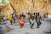 Hadzabe men and women dance and sing after a successful morning hunt near Lake Eyasi; Tanzania