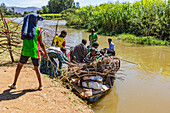 Ethiopian people boarding a boat on the Blue Nile River; Amhara Region, Ethiopia