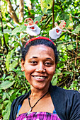 Ethiopian woman wearing a Christmas headband, Lake Tana; Amhara Region, Ethiopia