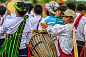 Burmese man playing the drum at a Pa'O festival; Yawngshwe, Shan State, Myanmar