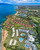 An aerial view of the Kea Lani Hotel looking North past Wailea Point to the Four Seasons and Grand Wailea Hotels, South Maui; Kihei, Maui, Hawaii, United States of America