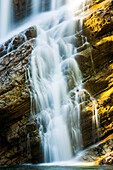 Close-up of waterfalls on angled rocky cliff, Waterton Lakes National Park; Waterton, Alberta, Canada