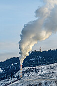Emissions from a stack fill the air at the end of a pipe; British Columbia, Canada