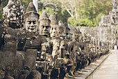 Statues at South gate to Bayon temple, Angkor Wat complex; Siem  Reap, Cambodia
