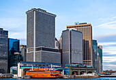 Downtown New York City and the Staten Island Ferry in the Whitehall Terminal; New York City, New York, United States of America