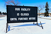 A sign indicating facility closures during the COVID-19 World Pandemic; Edmonton, Alberta, Canada