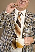 Retro Businessman Smoking a Cigar and Drinking a Cup of Coffee