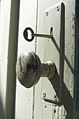 Close-Up of Old Doorknob and Key