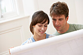 Couple Looking at Building Plans