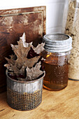 Dry Oak Leaves and Jar of Honey