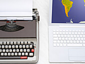 Laptop Computer and Typewriter