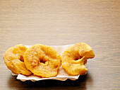 Baked apple slices with one bite missing, studio shot