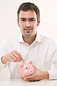 Man with Piggy Bank