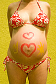 Woman, Nine Months Pregnant, With Body Paint on Her Belly