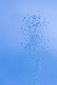Drops of water fountain against blue sky, Salzburg, Austria