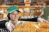 Baker Handling Tray of Baked Goods
