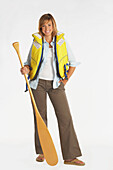 Portrait of Woman Wearing a Life Jacket and Holding a Canoe Paddle