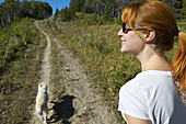 Woman Hiking With Her Dog