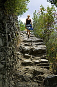 Woman Walking on Path, Cinque Terre, Liguria, Italy