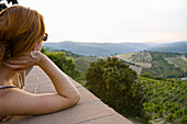 Woman Looking Out, Radda in Chianti, Province of Siena, Tuscany, Italy